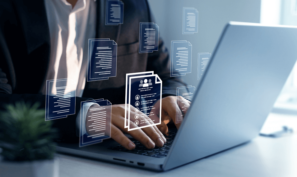 Man working with dealer profile management system on a laptop 