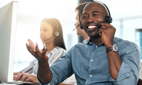 smiling customer service representative wearing a headset